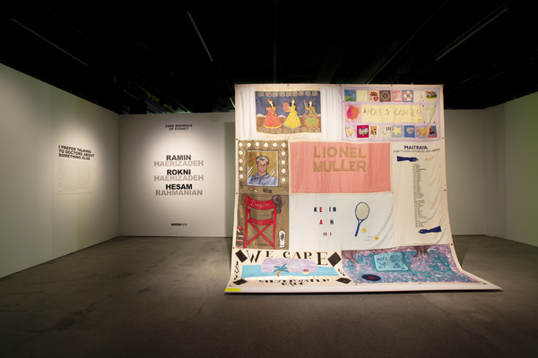Installation view of the exhibition entrance featuring the Australian AIDS Memorial Quilt (MAAS Collection 2011/109/5).
